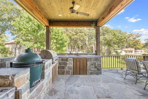 a view of a patio with a table and chairs