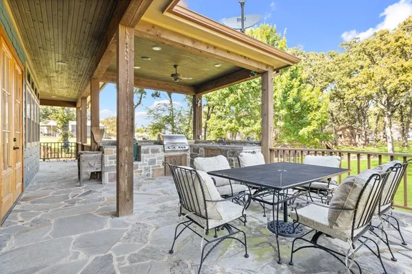 a view of balcony with furniture