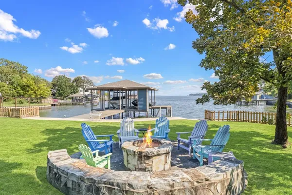 a view of a chairs and backyard