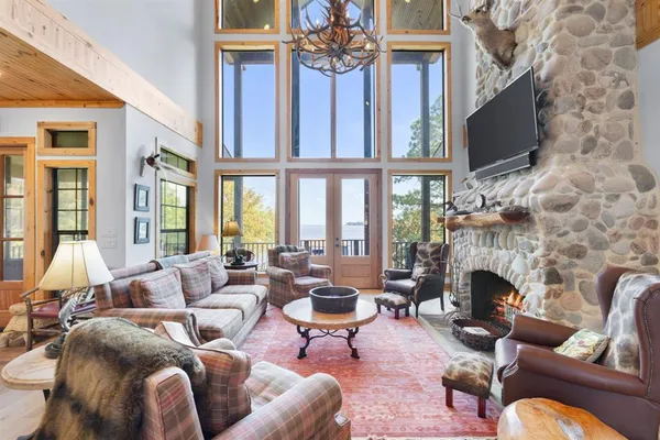 a living room with furniture a fireplace and a flat screen tv