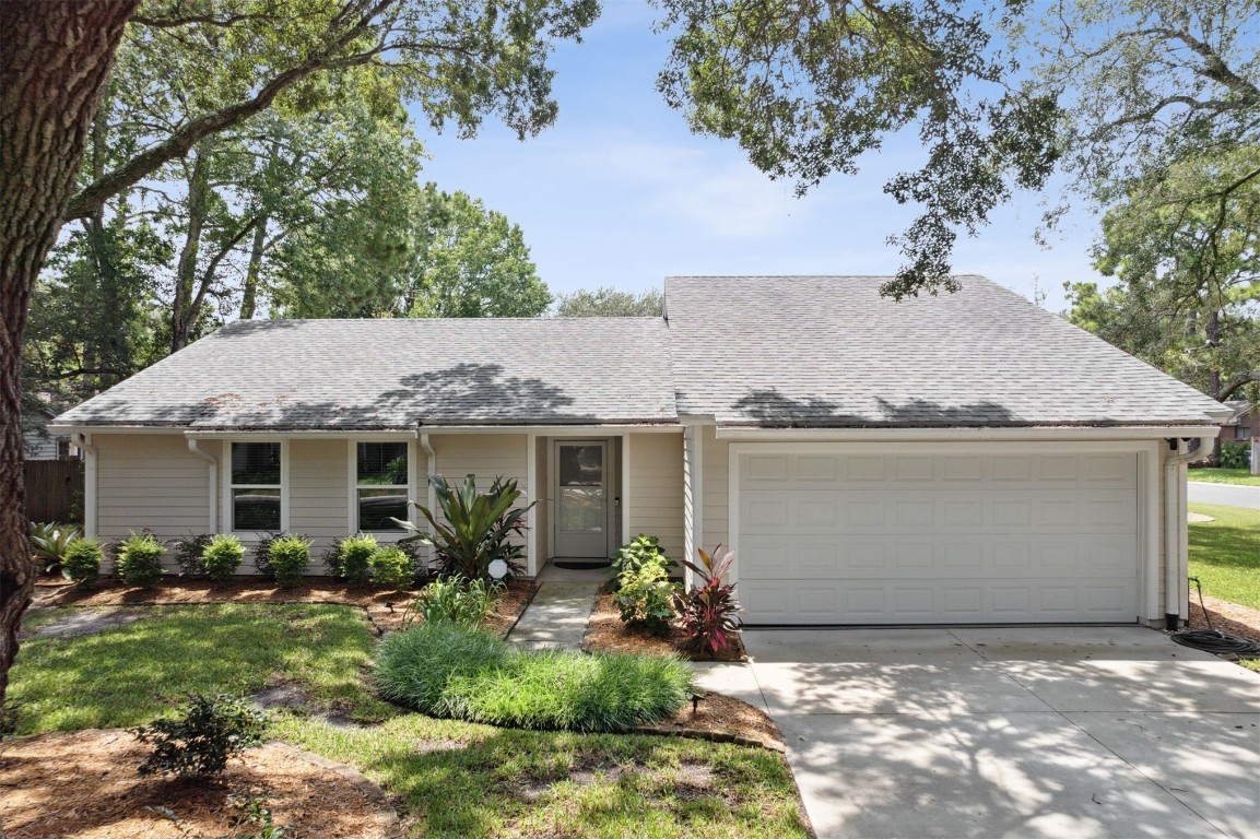 1710 Crescent Drive Fernandina Beach, FL 32034 - Photo 1 of 45 a house view with a garden space