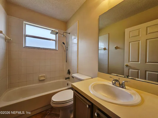 a bathroom with a sink a toilet and a bathtub
