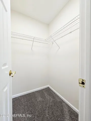 a view of a room with racks on the wall