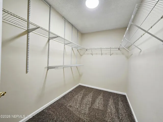 a view of a room with racks on the wall