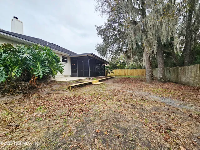 a backyard of a house with lots of green space
