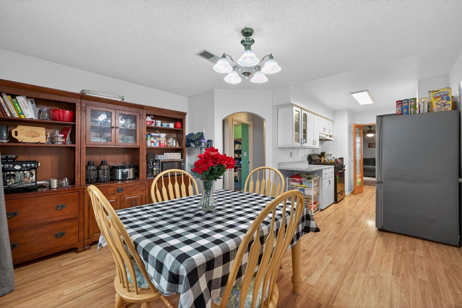 6816 Tareyton Way Citrus Heights, CA 95621 - Photo 11 of 46 a view of a dining room with furniture and a chandelier