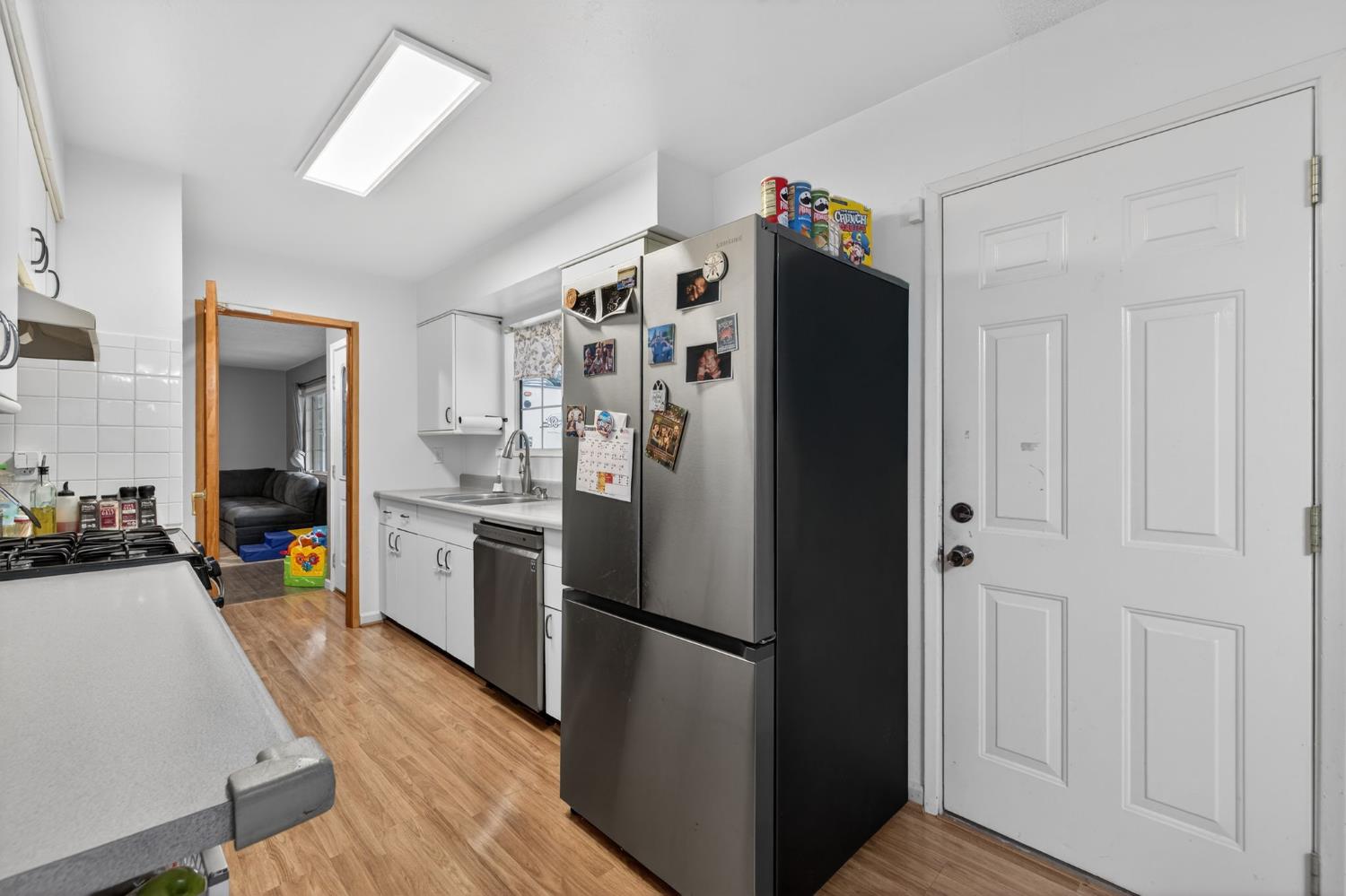 6816 Tareyton Way Citrus Heights, CA 95621 - Photo 15 of 46 a kitchen with stainless steel appliances a refrigerator and wooden floor