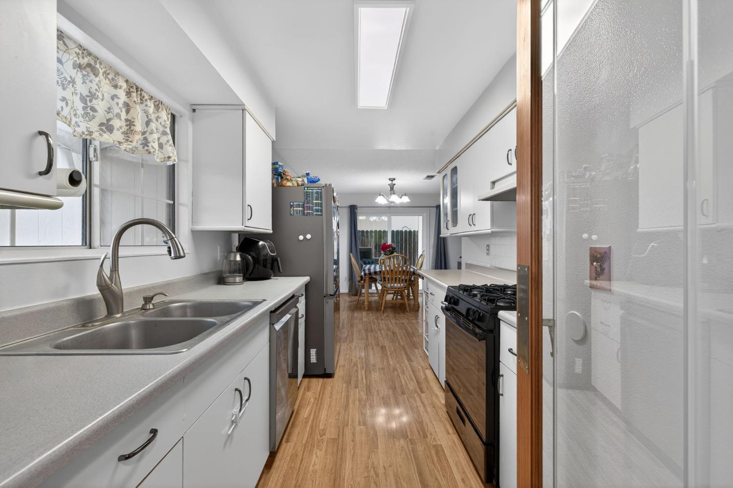 6816 Tareyton Way Citrus Heights, CA 95621 - Photo 2 of 46 a kitchen with a sink stove and refrigerator
