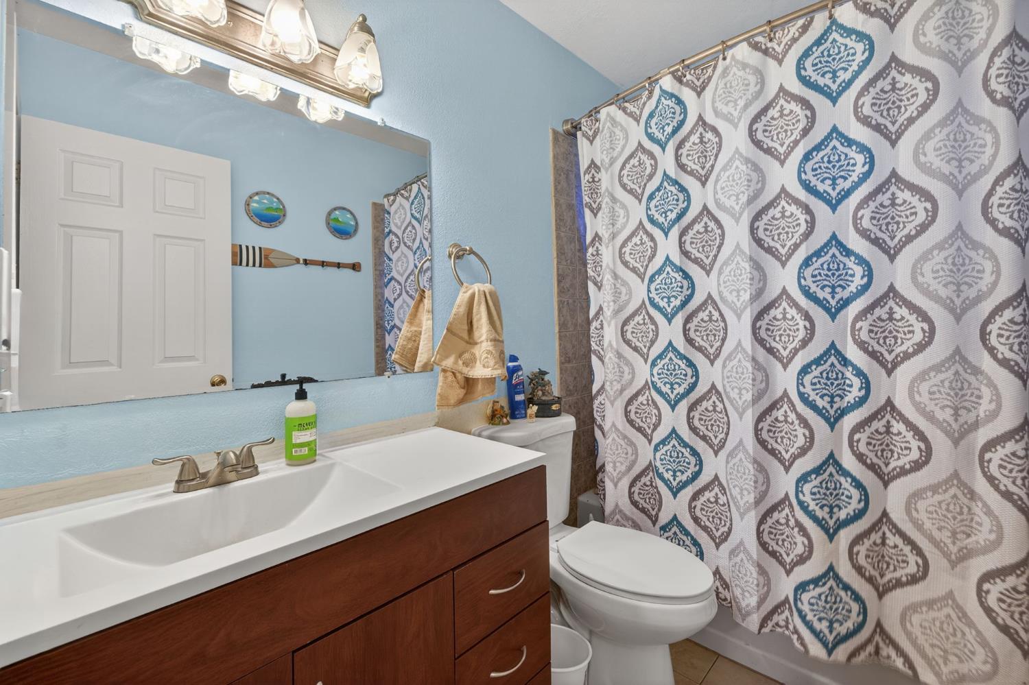 6816 Tareyton Way Citrus Heights, CA 95621 - Photo 22 of 46 a bathroom with a sink mirror vanity and toilet