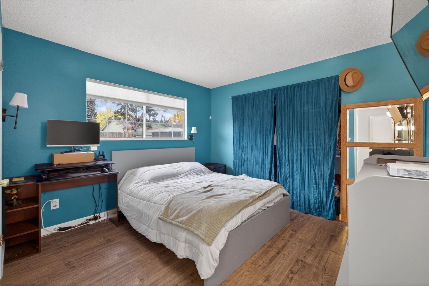 6816 Tareyton Way Citrus Heights, CA 95621 - Photo 23 of 46 a bedroom with a bed and a flat screen tv