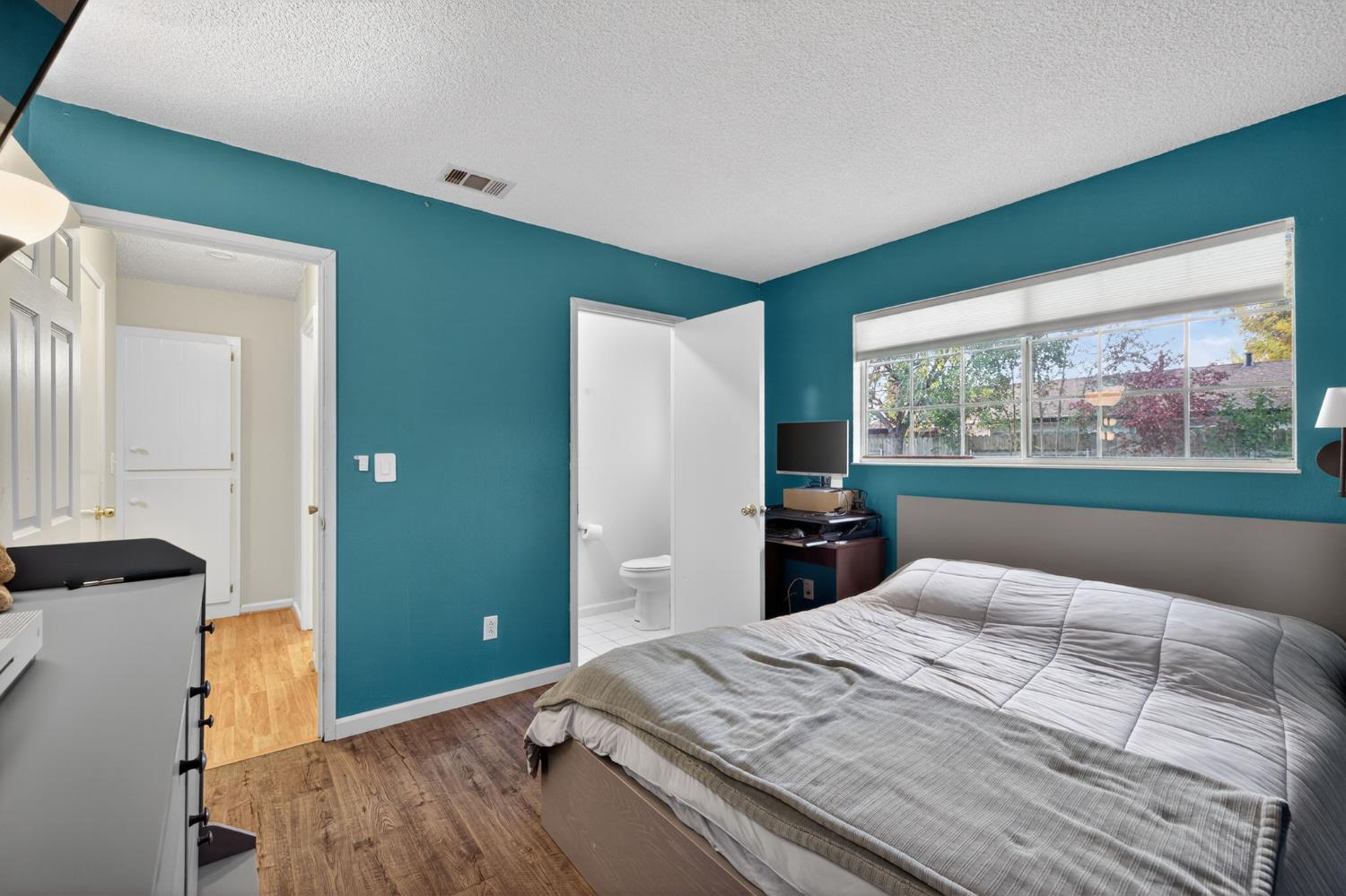 6816 Tareyton Way Citrus Heights, CA 95621 - Photo 24 of 46 a bedroom with a large bed and a large window