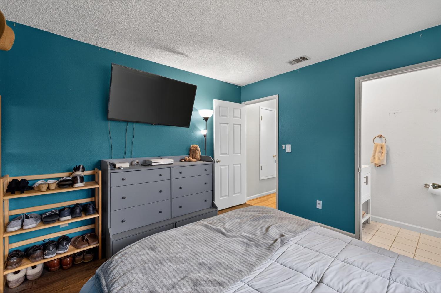 6816 Tareyton Way Citrus Heights, CA 95621 - Photo 25 of 46 a bedroom with a bed and a flat screen tv