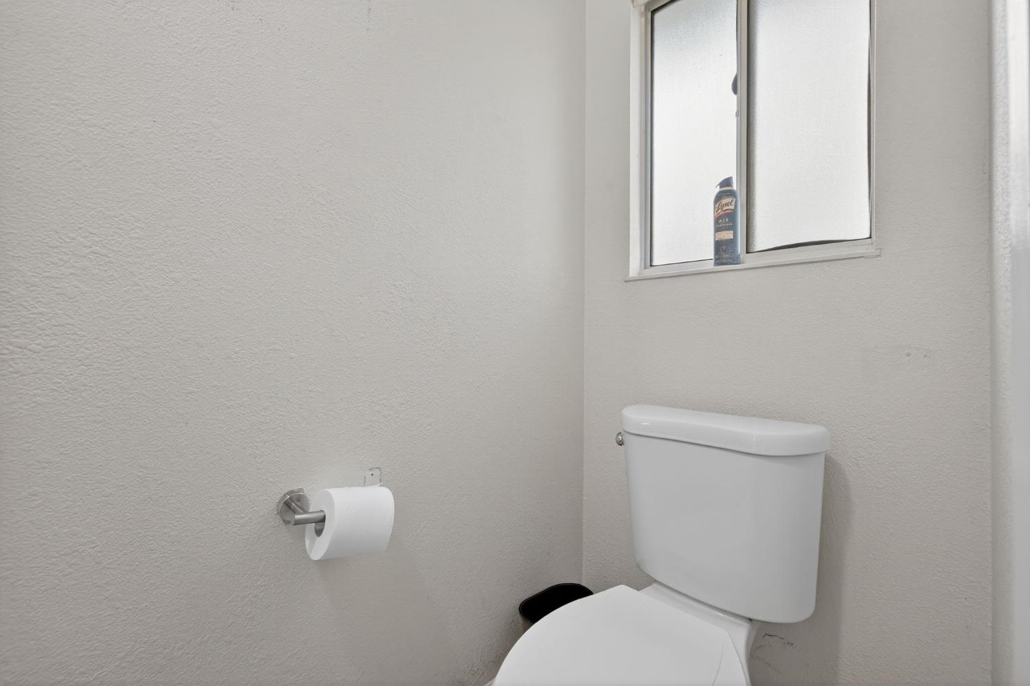 6816 Tareyton Way Citrus Heights, CA 95621 - Photo 27 of 46 a white toilet sitting next to a bathroom sink