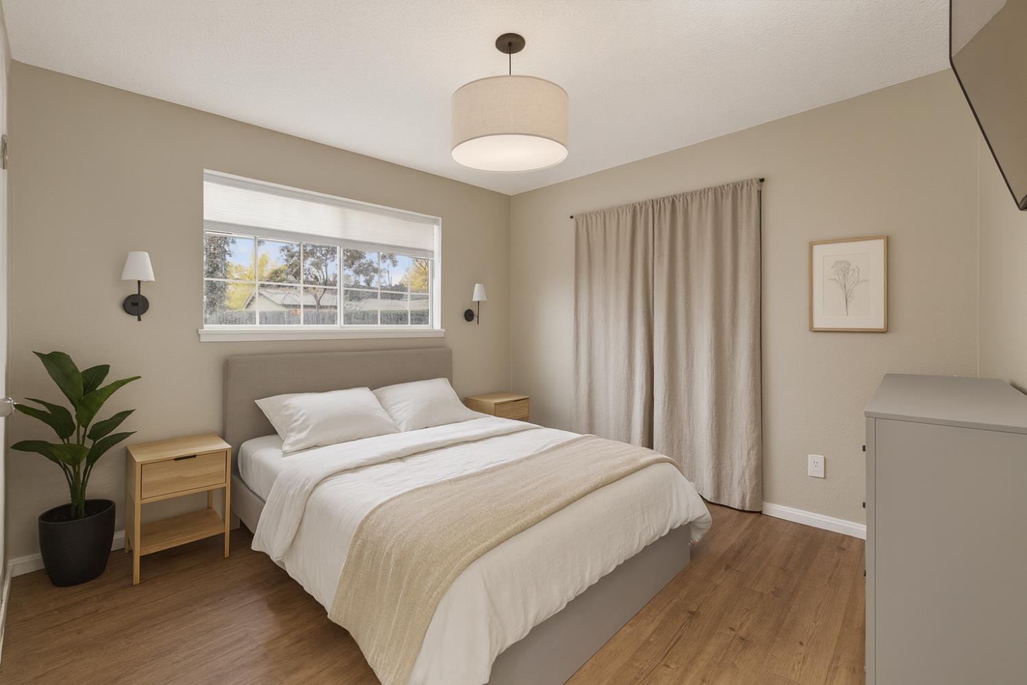 6816 Tareyton Way Citrus Heights, CA 95621 - Photo 44 of 46 a bedroom with a large bed and a chandelier