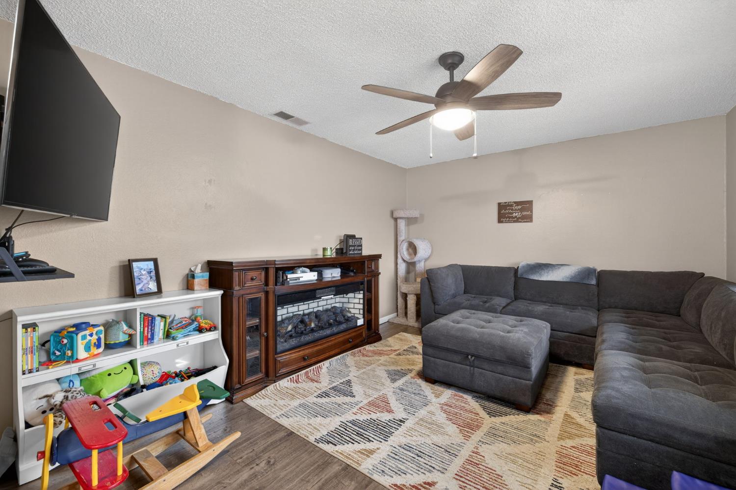 6816 Tareyton Way Citrus Heights, CA 95621 - Photo 7 of 46 a living room with furniture and a flat screen tv