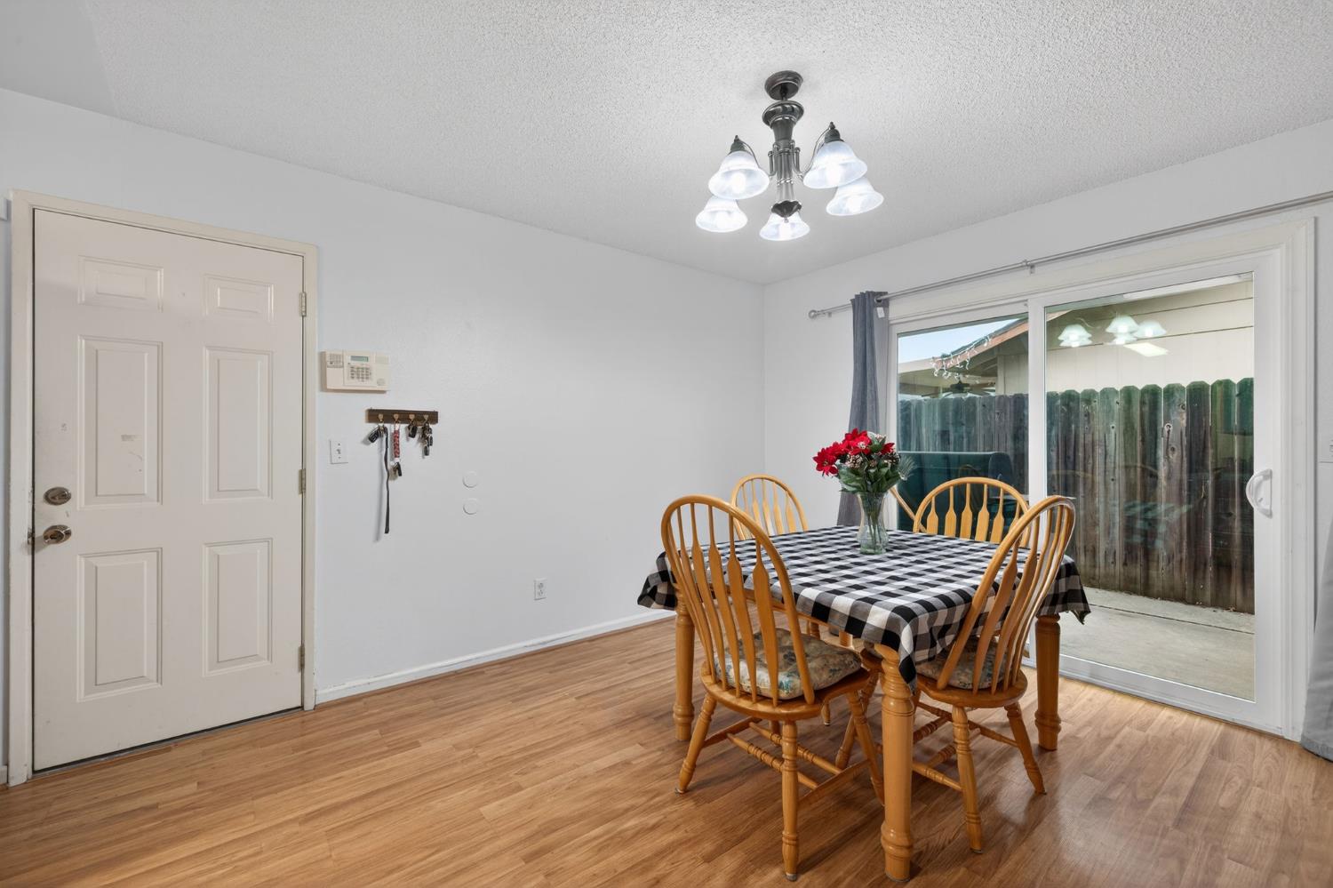 6816 Tareyton Way Citrus Heights, CA 95621 - Photo 9 of 46 a dining room with furniture potted plants and wooden floor