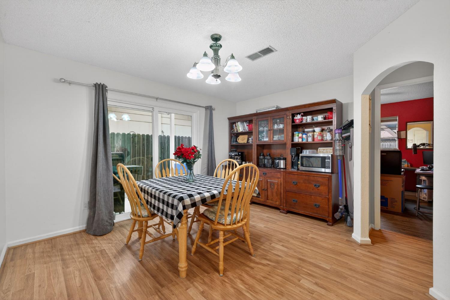 6816 Tareyton Way Citrus Heights, CA 95621 - Photo 10 of 46 a dining room with furniture and wooden floor