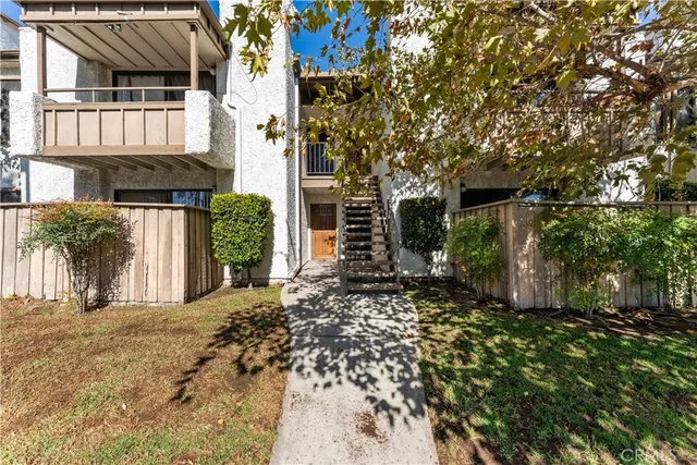a view of a house with a tree