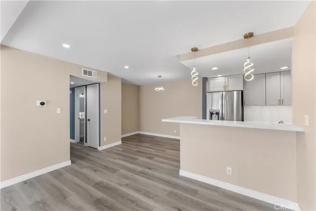 a view of kitchen with wooden floor