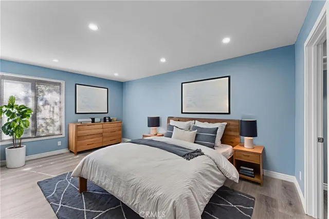 a bedroom with bed and a couch