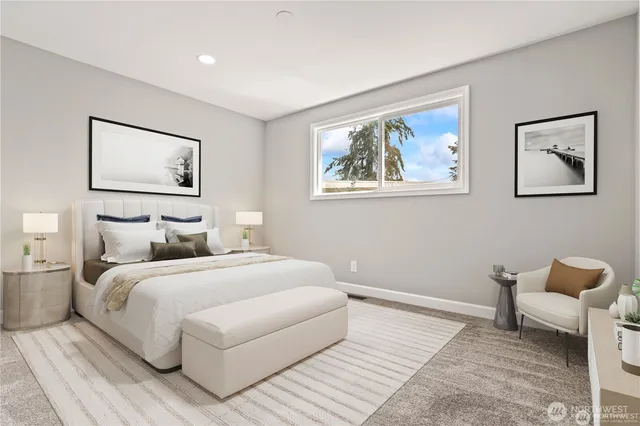 a bedroom with a bed and a painting on the wall