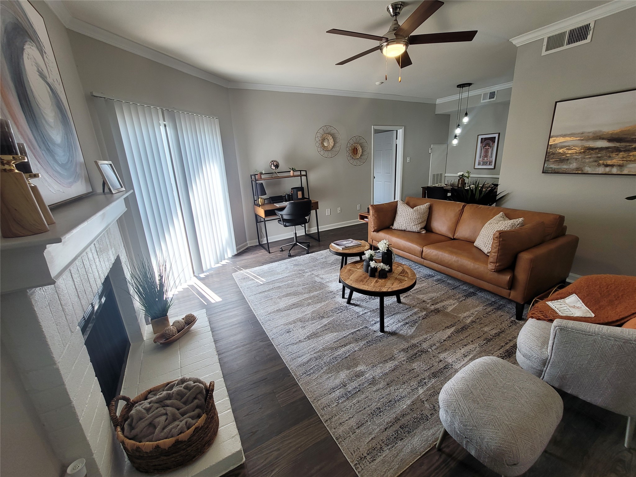 7250 West Greens Road, Unit 911 Houston, TX 77064 - Photo 1 of 9 a living room with furniture and a fireplace