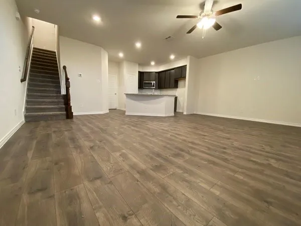 a view of a livingroom with a kitchen