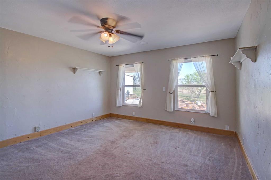 3559 Springfield Road Springtown, TX 76082 - Photo 13 of 36 a view of an empty room with a window