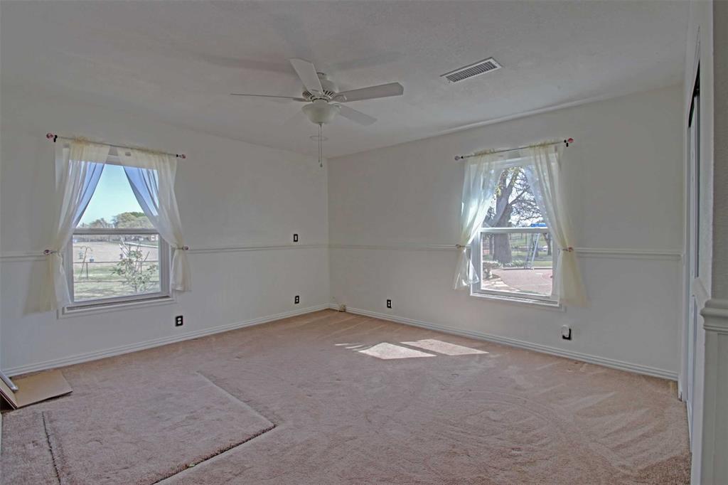 3559 Springfield Road Springtown, TX 76082 - Photo 14 of 36 a view of an empty room with a window