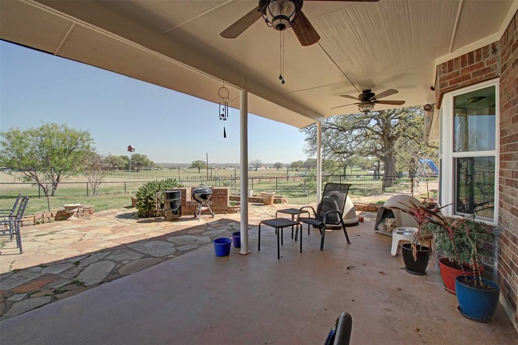 3559 Springfield Road Springtown, TX 76082 - Photo 18 of 36 a very nice looking living room with a table and chairs