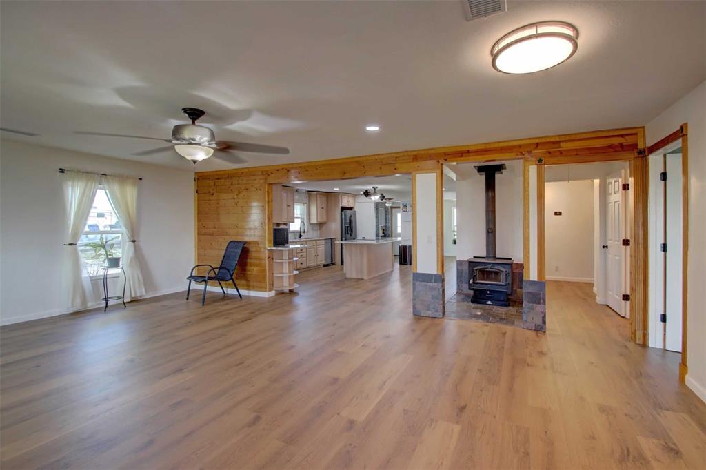 3559 Springfield Road Springtown, TX 76082 - Photo 36 of 36 a living room with furniture and a wooden floor