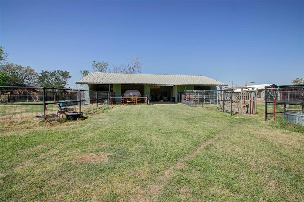 3559 Springfield Road Springtown, TX 76082 - Photo 22 of 36 a view of a swimming pool with table and chairs