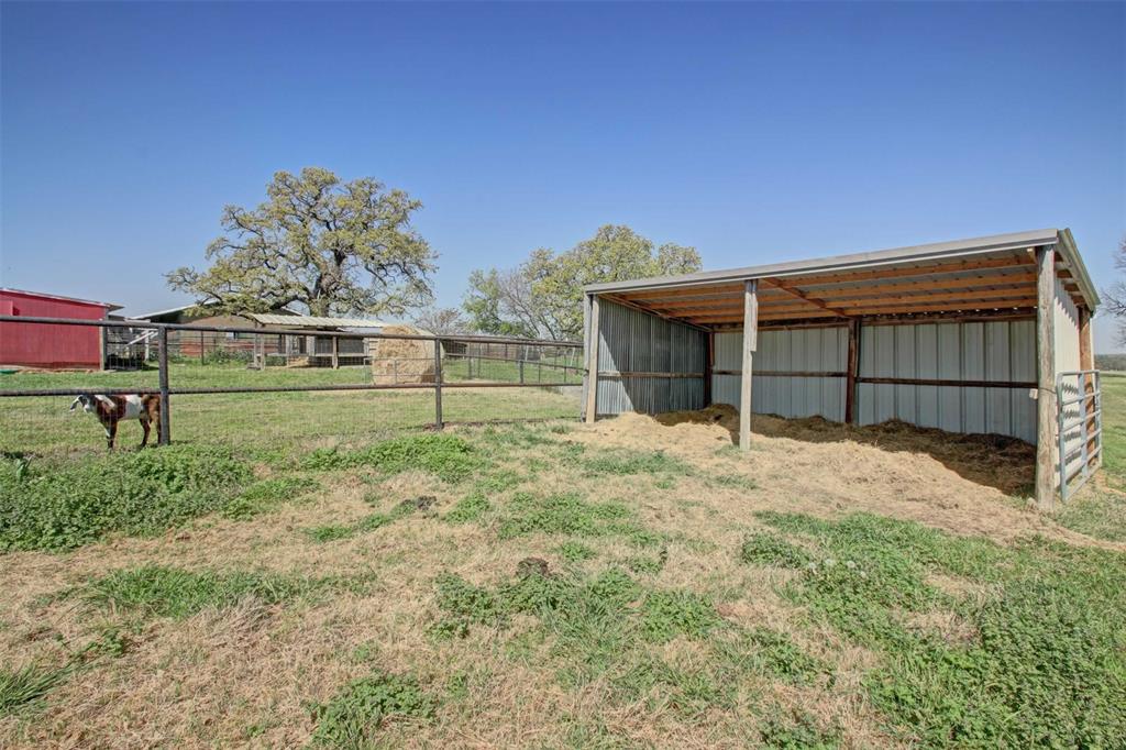3559 Springfield Road Springtown, TX 76082 - Photo 25 of 36 a view of a backyard