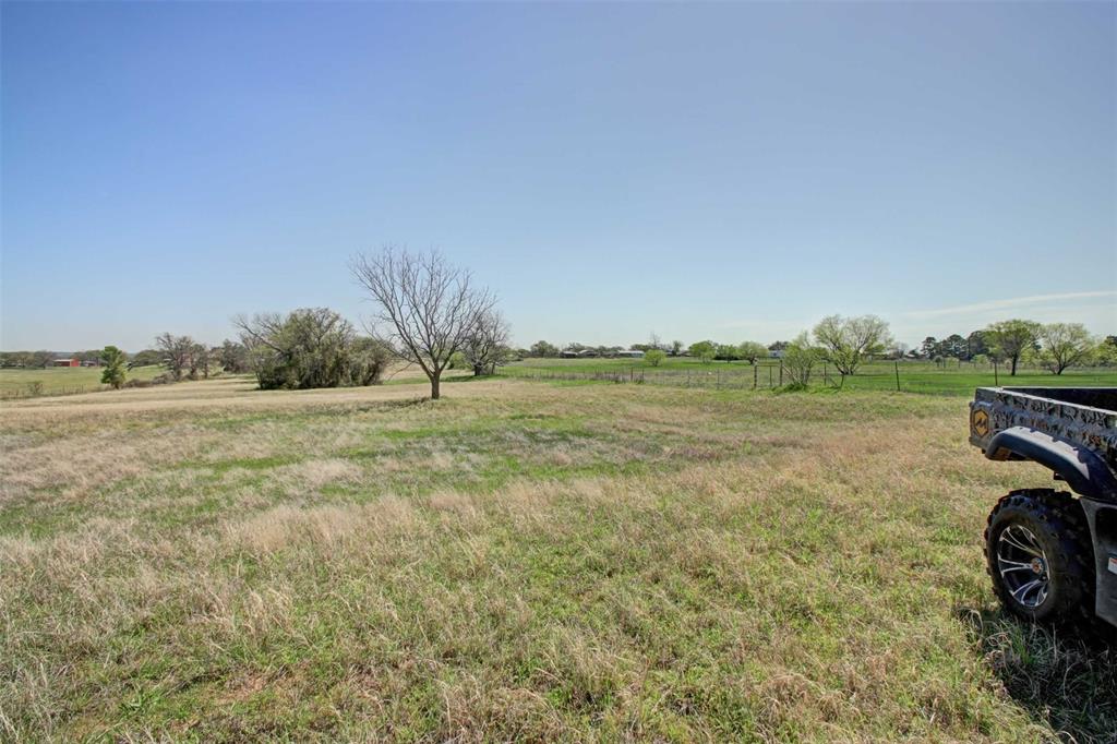 3559 Springfield Road Springtown, TX 76082 - Photo 30 of 36 a view of a field with an trees