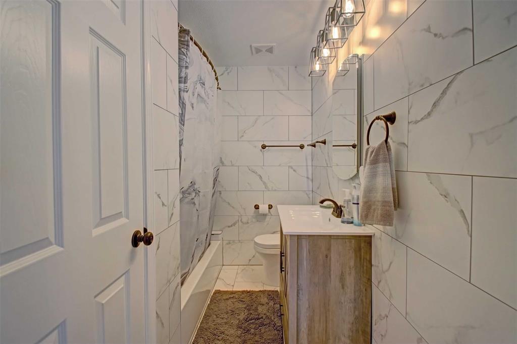 3559 Springfield Road Springtown, TX 76082 - Photo 9 of 36 a bathroom with a sink and shower