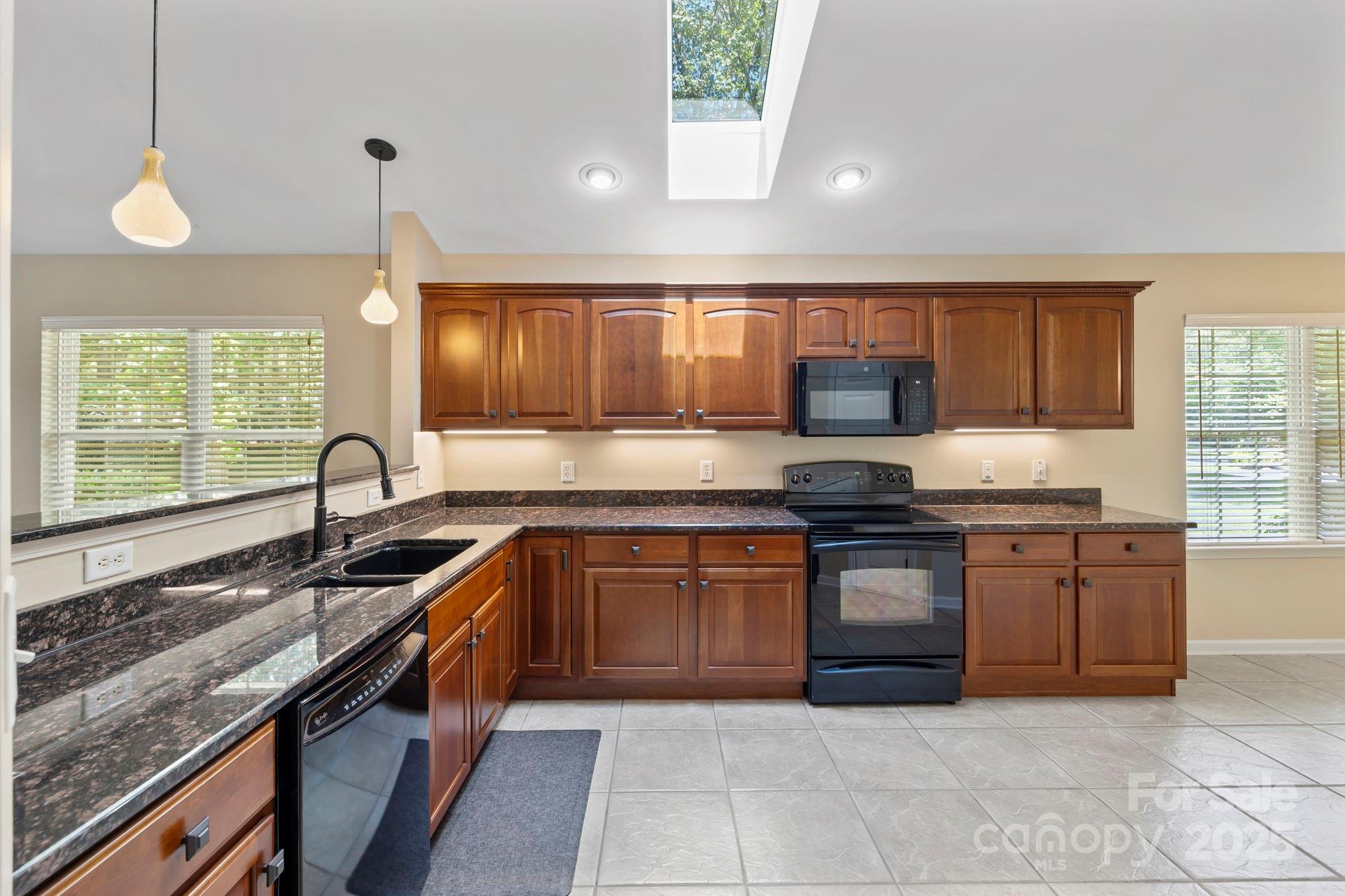 241 Fairway View Drive Etowah, NC 28729 - Photo 17 of 37 a kitchen with stainless steel appliances granite countertop a sink and stove
