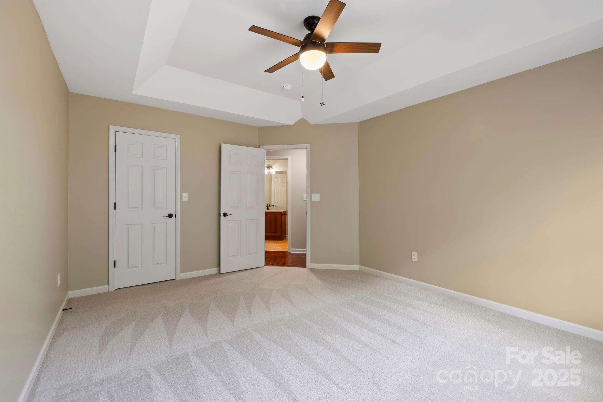 241 Fairway View Drive Etowah, NC 28729 - Photo 23 of 37 a view of a big room with a ceiling fan and a window