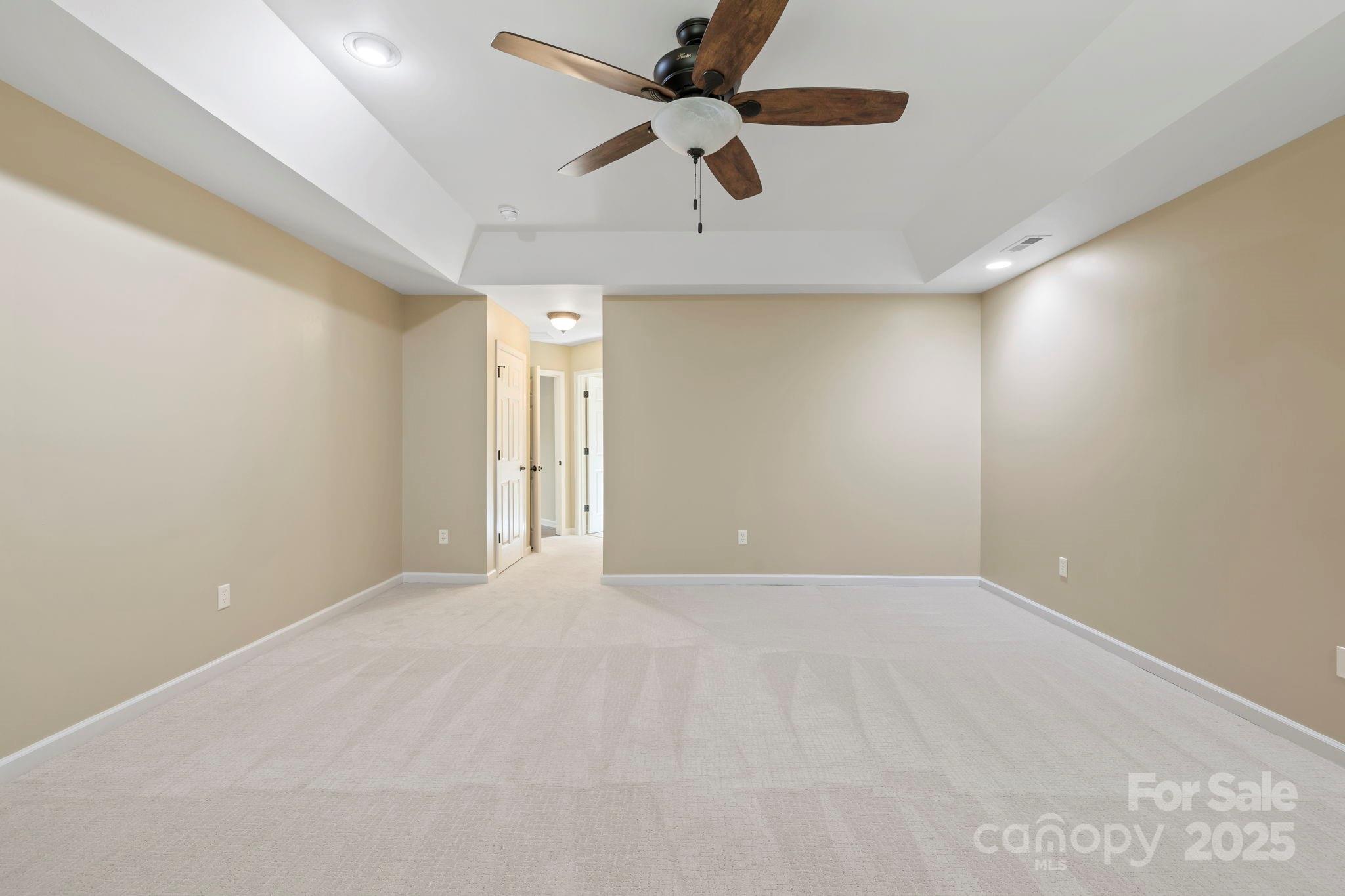 241 Fairway View Drive Etowah, NC 28729 - Photo 28 of 37 an empty room with a ceiling fan and a ceiling fan