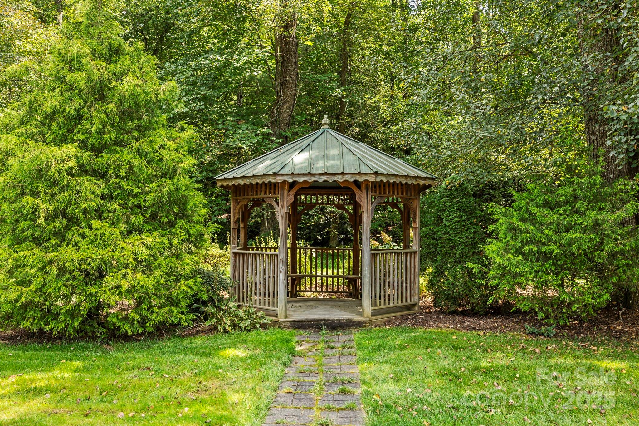 241 Fairway View Drive Etowah, NC 28729 - Photo 37 of 37 a front view of a house with a garden