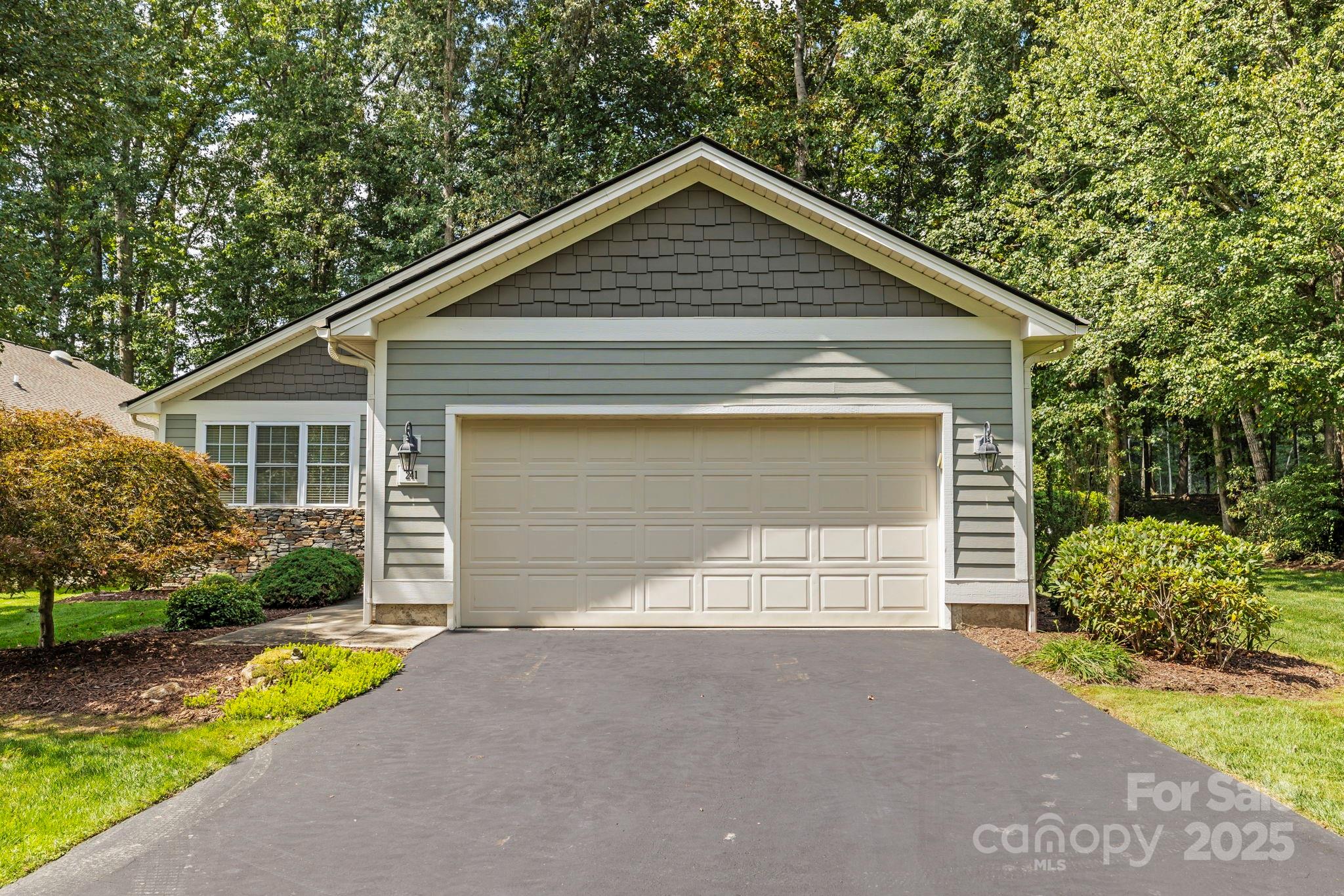 241 Fairway View Drive Etowah, NC 28729 - Photo 4 of 37 a front view of house with garage and yard