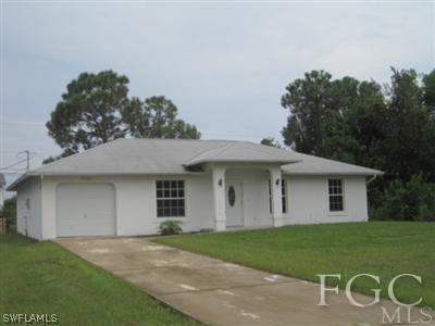 8080 Albatross Road Fort Myers, FL 33967 - Photo 1 of 2 a front view of a house with a garden