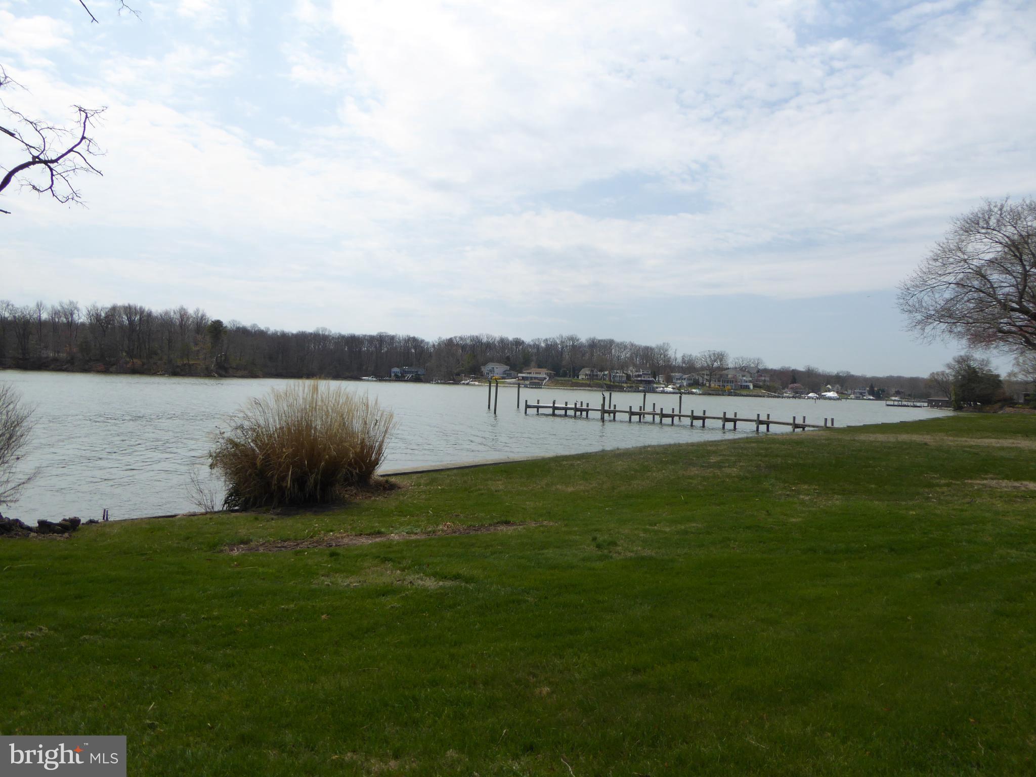 348 Miles Road Baltimore, MD 21221 - Photo 2 of 10 a view of a lake with houses in the back