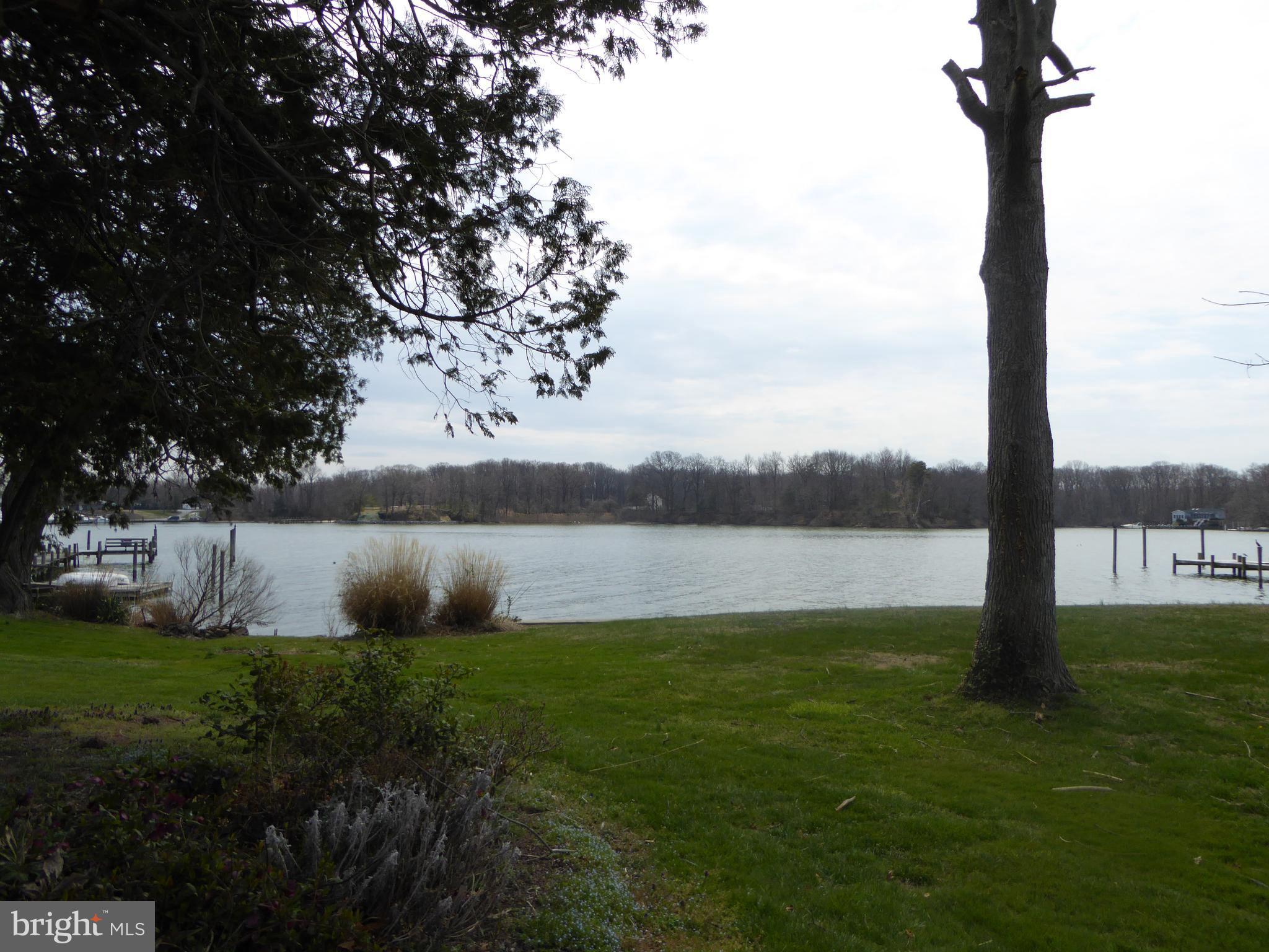 348 Miles Road Baltimore, MD 21221 - Photo 7 of 10 a view of lake with a yard