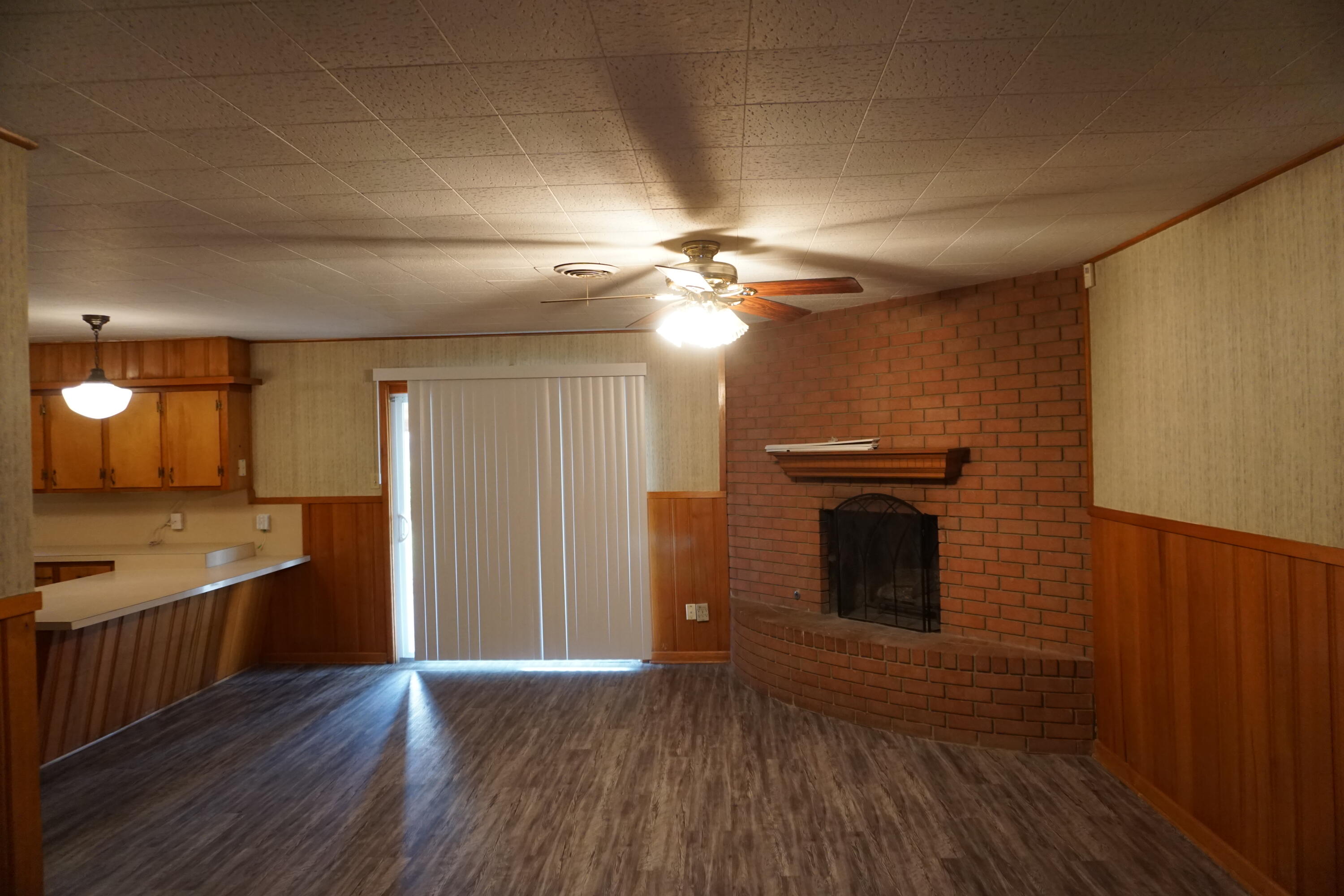 5414 7th Street Lubbock, TX 79416 - Photo 2 of 11 a view of a kitchen cabinets and wooden floor