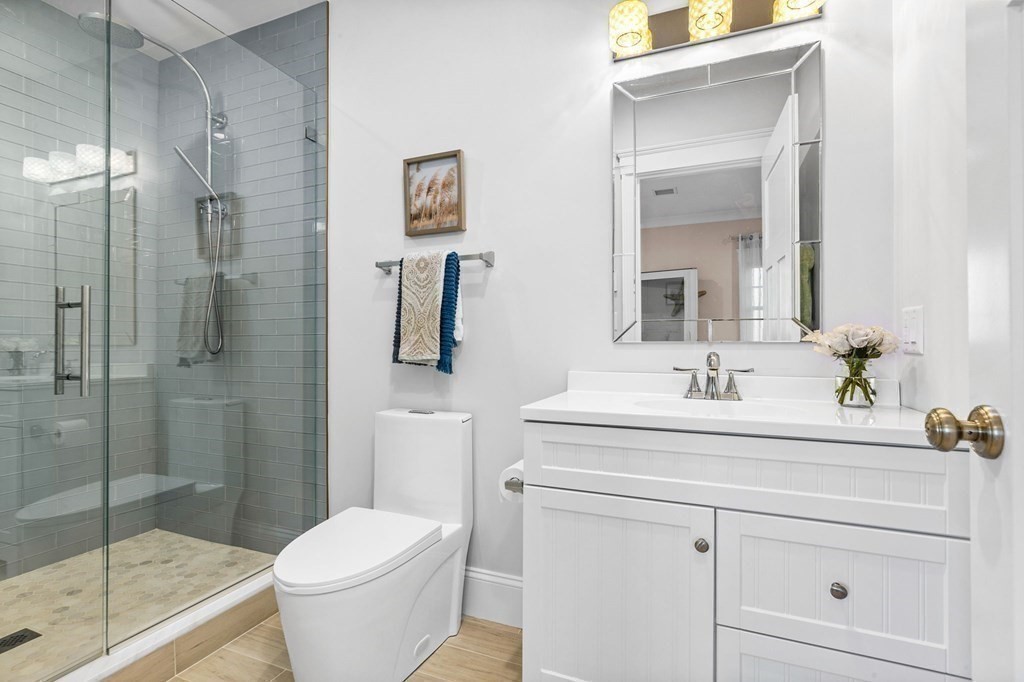 20 Collier Road Scituate, MA 02066 - Photo 20 of 42 a bathroom with a sink toilet and shower