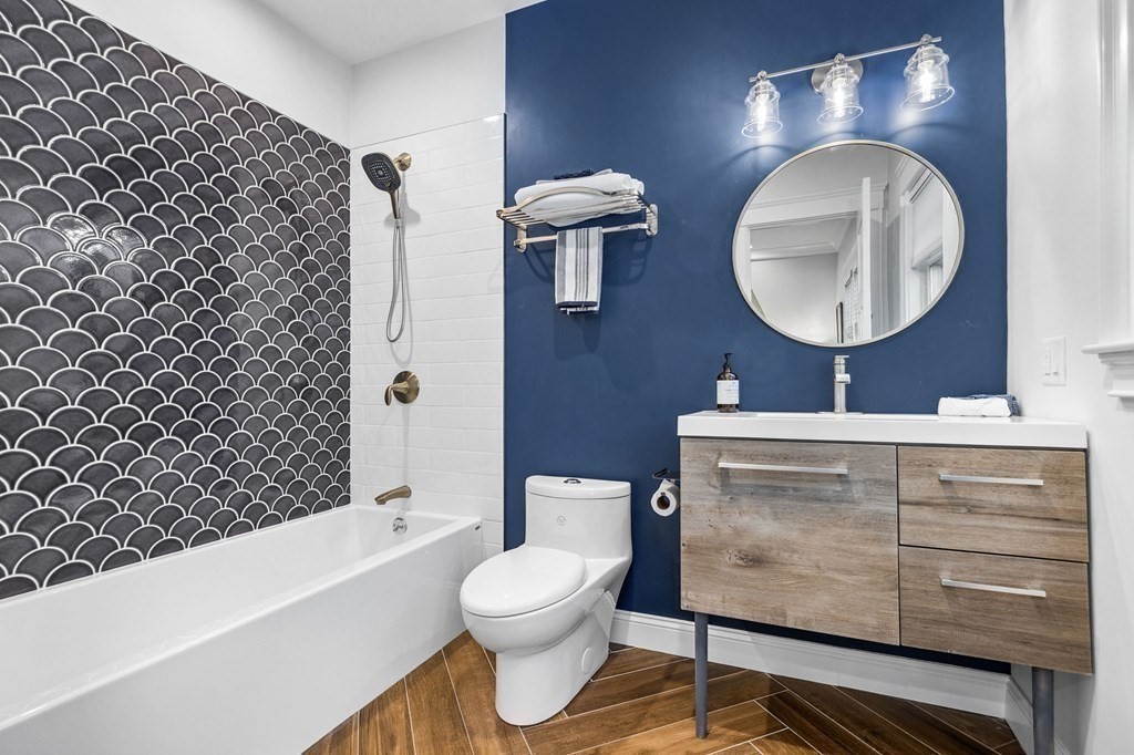 20 Collier Road Scituate, MA 02066 - Photo 22 of 42 a bathroom with a toilet a sink and bathtub