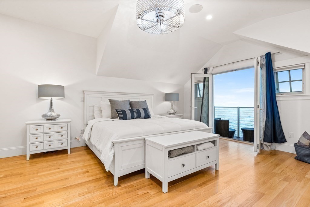 20 Collier Road Scituate, MA 02066 - Photo 29 of 42 a spacious bedroom with a bed and a flat tv screen on dresser