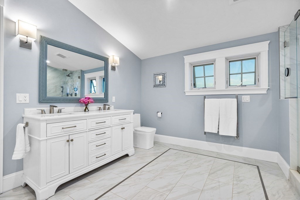 20 Collier Road Scituate, MA 02066 - Photo 32 of 42 a spacious bathroom with a double vanity sink a mirror and a toilet