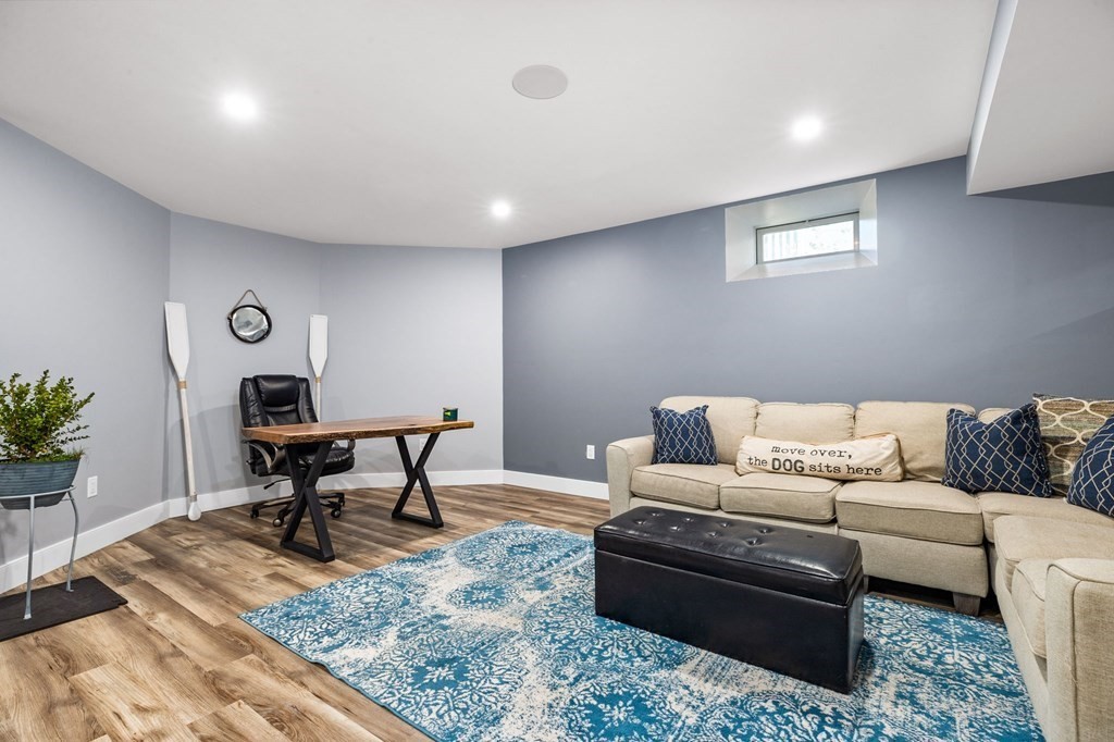 20 Collier Road Scituate, MA 02066 - Photo 35 of 42 a living room with furniture rug and a table