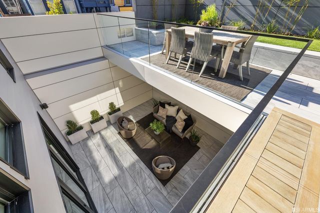 a kitchen with stainless steel appliances granite countertop a sink and a stove